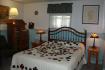 Lancaster Rose is a charming room with it's beautiful Amish Quilt on the plush pillow top queen bed.  There is a charming 'wood stove' in the room, along with a television and comfortable sitting area.  The walk in shower has dual shower heads. 