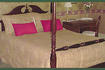 Queen-sized cherry four poster bed